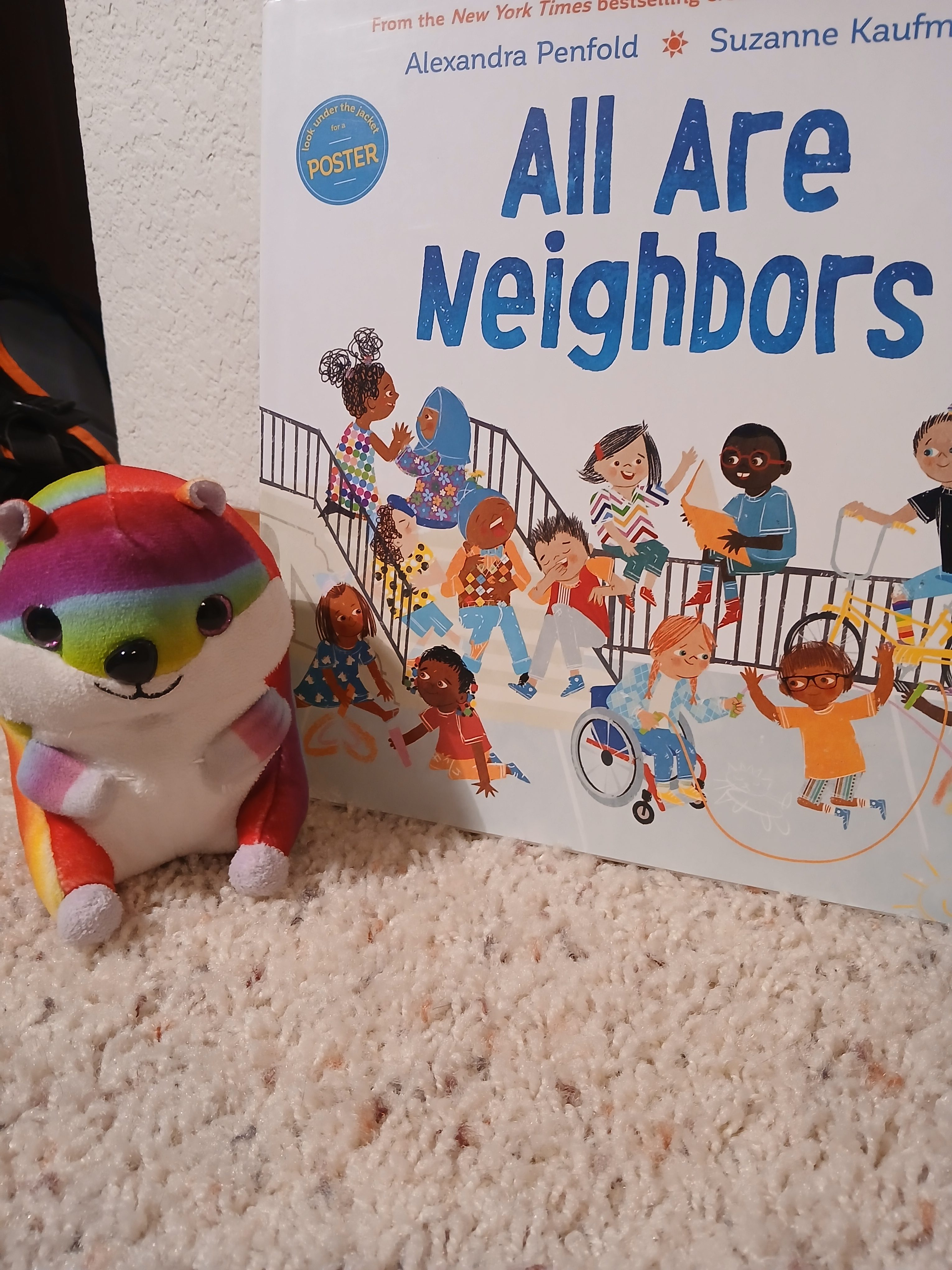 Book Nook- We All are Neighbors